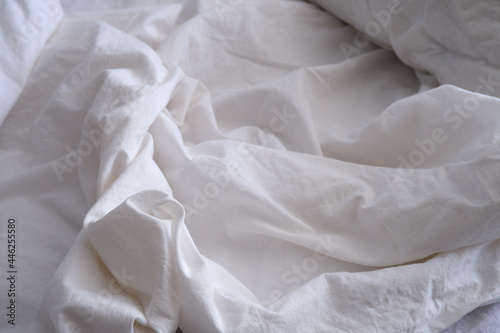 Bed linen texture. White bed linen background. Bed. Interior.