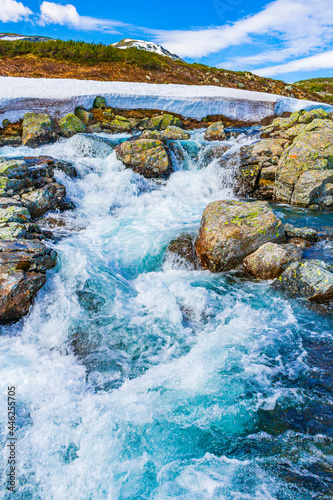 Beautiful Storebottane river vavatn lake with snow Hemsedal Norway. photo