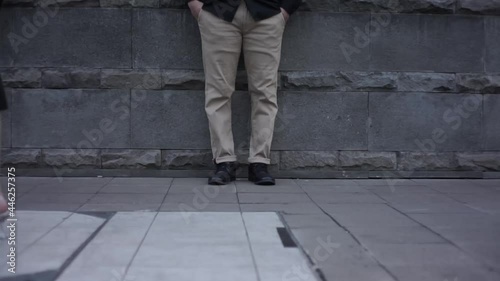 pedestrians, female and male feet on the sidewalk