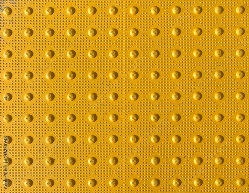 yellow tactile crosswalk sidewalk intersection pavement  rumble nonslip surface for waiting to cross the road photo
