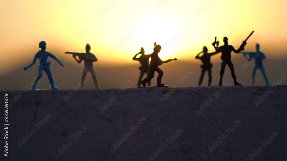 Silhouette shot of toy soldiers in front of the sunset Silhouette shot of toy soldiers in front of the sunset