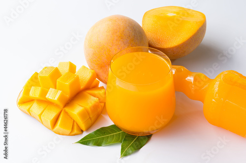 R2E2 mangoes juice fruit in glass and slice on dish .concept organic fruit and vitamin healthy. photo