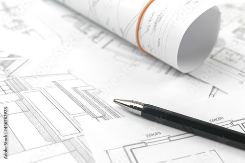 Architect design working background, drawing sketch plans blueprints and making architectural constructions concept