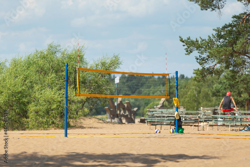 Empty yellow volleyball net on the beach