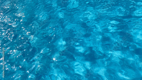 Blue water swimming pool texture, underwater pattern