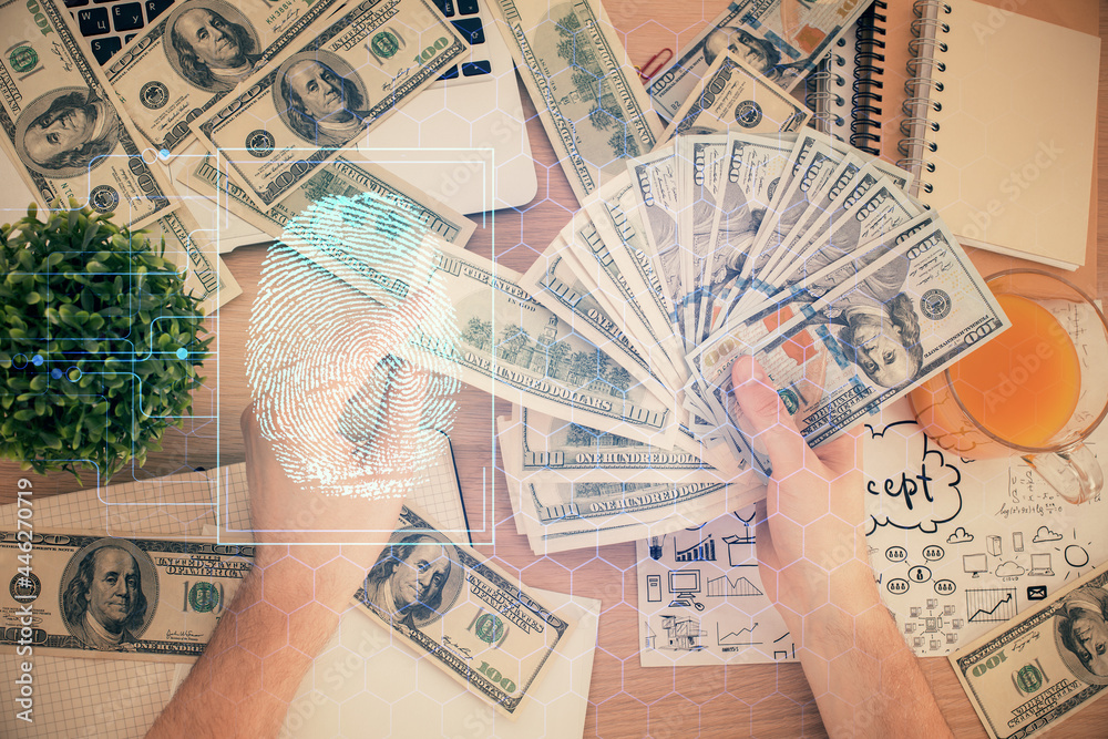 Multi exposure of fingerprint drawing hologram and USA dollars bills and man hands. security concept.