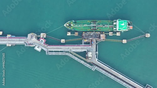 Aerial view of Crude oil tanker ship of lpg ngv at industrial estate port of Thailand. Business of logistic, sea freigh, import export with cargo ship. VDO 4K. photo