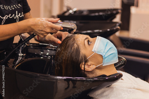 woman getting hair wash in hair salon