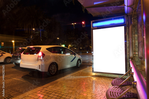 billboard at taxi rank, at night in the city