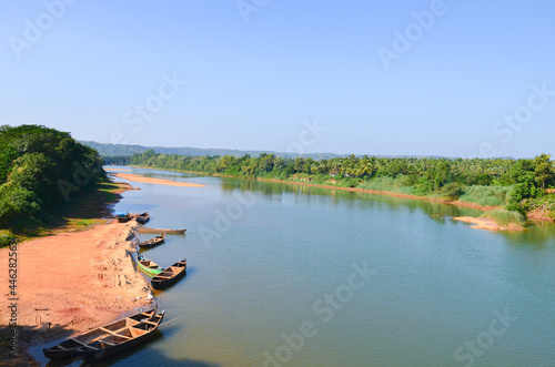 Picturesque view of Phalguni River with hills and fields in the background at Polali, Mangalore, Karnataka, India photo