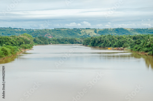 Picturesque view of Phalguni River with hills and fields in the background at Polali  Mangalore  Karnataka  India