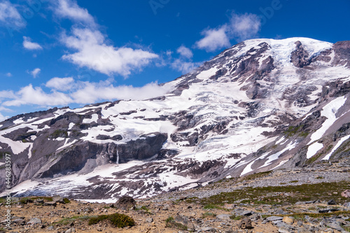 Mount Rainier with a blue sky and a few clouds during summer