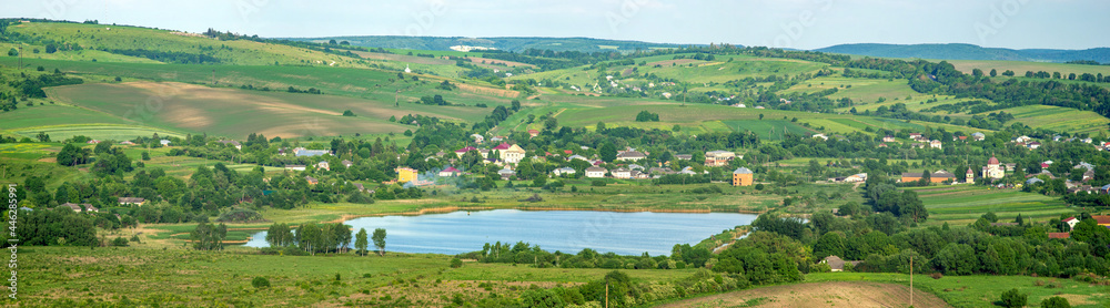 Lake near the village on a summer day Lake near the village on a summer day