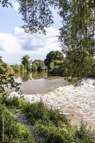The weir on the River Severn at Upper Parting near the Severn Vale village of Maisemore, Gloucestershire UK