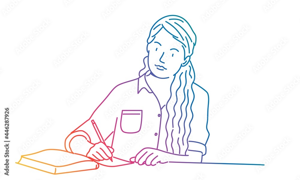Cute woman with long hair writing a letter or doing homework at the table.