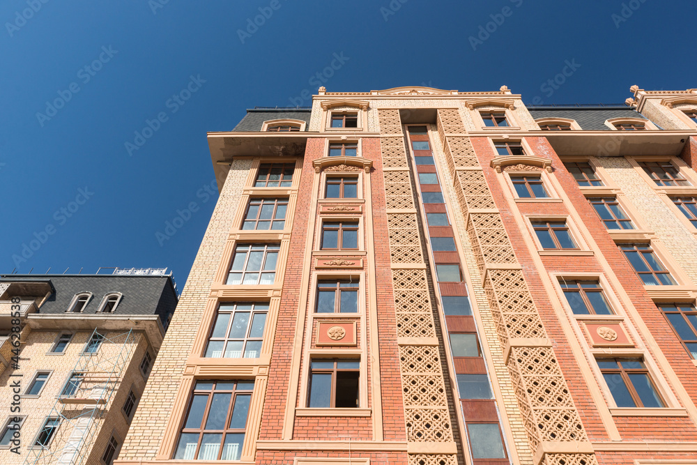 Fototapeta premium Modern apartment complex design. Building under construction