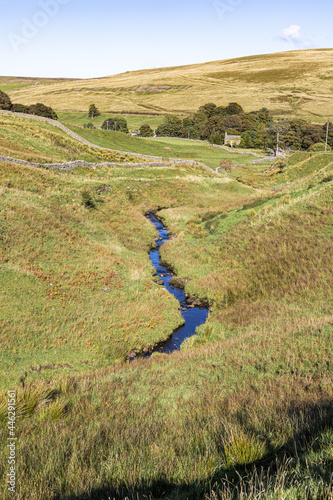 Swinhope Burn flowing from Swinhope Moor on Allendale Common, west of Allenheads, Northumberland UK photo