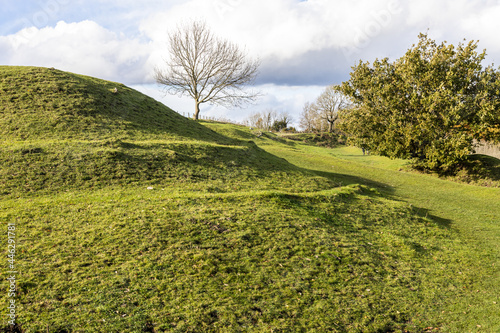 Some of the Iron Age ramparts of Uley Bury a large multivallate hillfort on a spur of the Cotswold escarpment at Uley, Gloucestershire UK photo