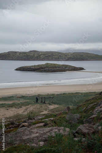 A small island during the low tide drive near the village of Teriberka, Barents Sea. Kola Peninsula, Russia.