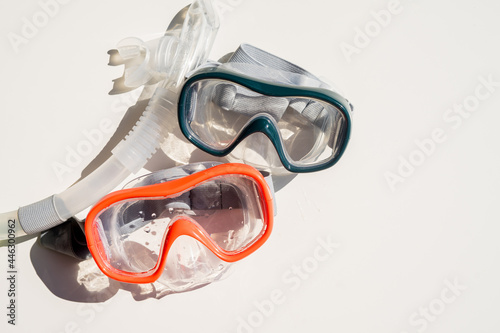 Scuba goggles with breathing tube on isolated white background 