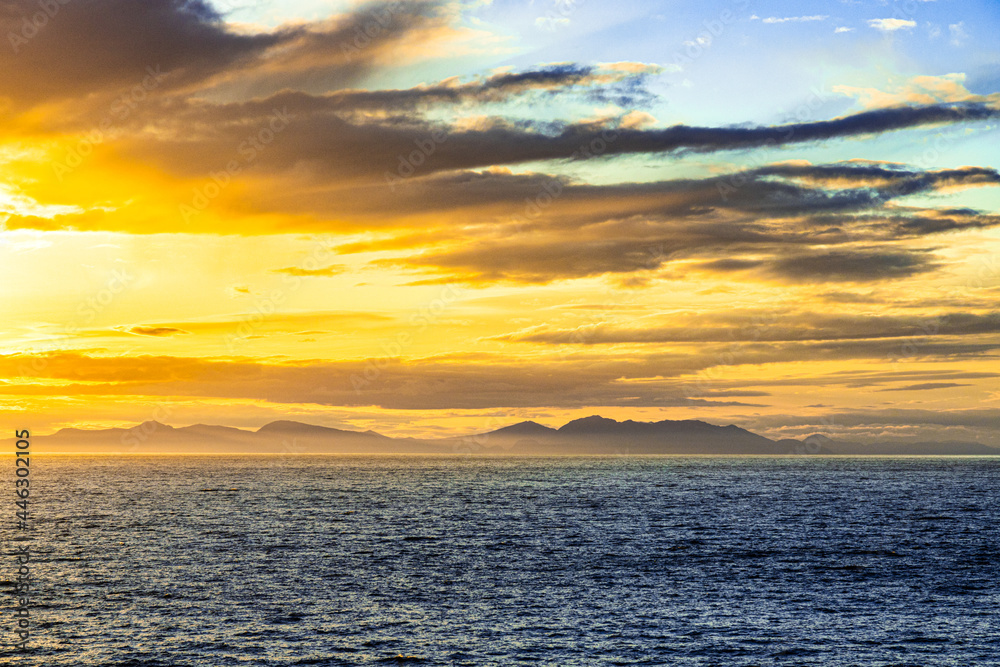 A sunset over the NW Pacific coast near Prince of Wales Island, Alaska, USA - Viewed from a cruise ship sailing the Inside Passage