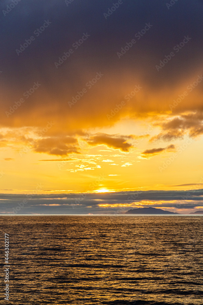 A sunset over the NW Pacific coast near Prince of Wales Island, Alaska, USA - Viewed from a cruise ship sailing the Inside Passage