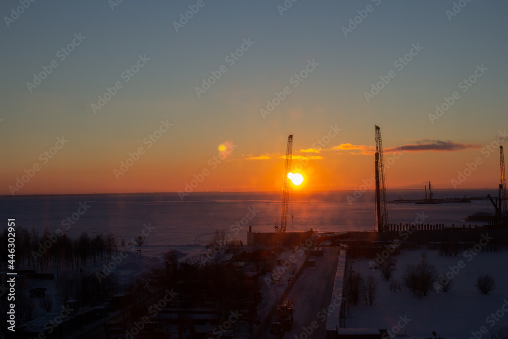 Skyline with sunset, construction and Russian winter