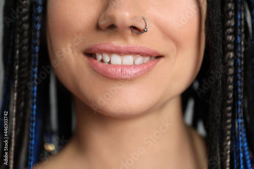 Young woman with nose piercing and dreadlocks, closeup