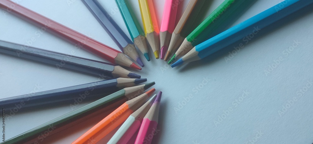 a set of colored pencils on an isolated white background a set of colored pencils on an isolated white background
