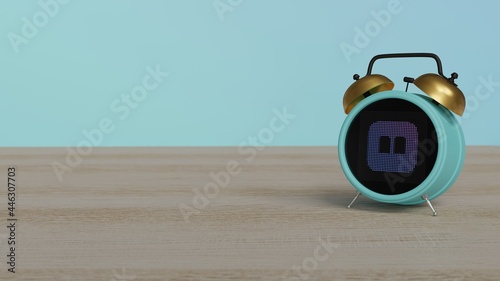 3d rendering of color alarm clock with symbol of iBook on display on table photo