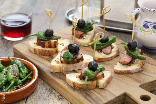 padron pepper, chorizo, and bacon pintxos.  spanish appetizer photo