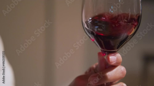 enjoying good red wine in restaurant, closeup of wine glass with wine inside photo