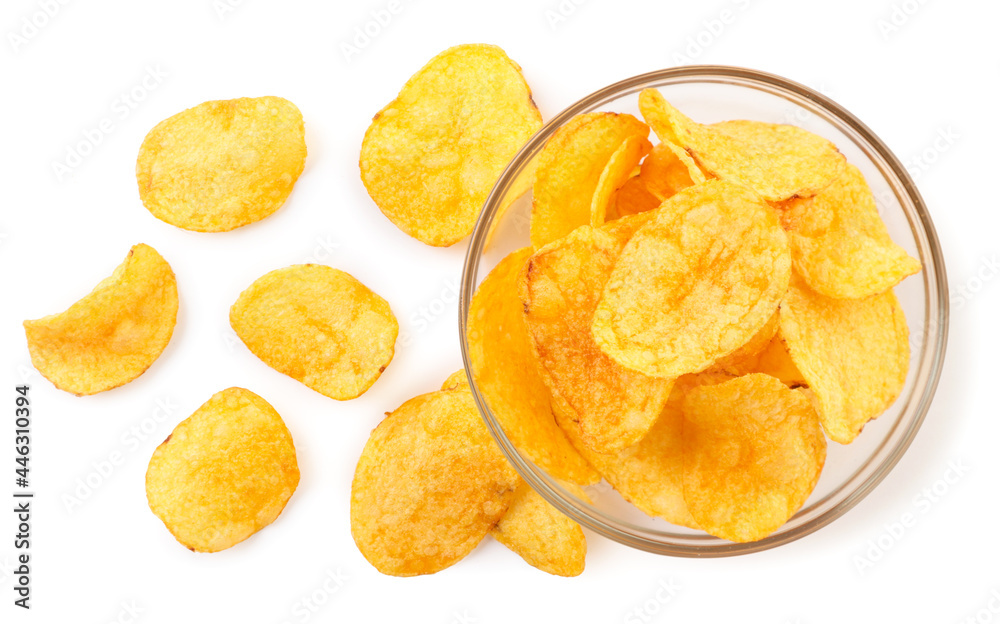 Potato chips sprinkled and in a glass plate on a white background. Top view. Potato chips sprinkled and in a glass plate on a white background. Top view.