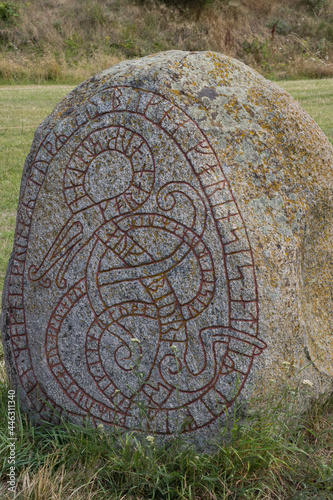 viking rune stone with midgard serpent photo