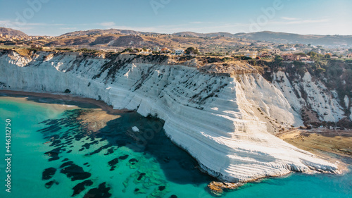 Scala dei Turchi,Sicily,Italy.Aerial view of white rocky cliffs,turquoise clear water.Sicilian seaside tourism,popular tourist attraction.Limestone rock formation on coast.Travel holiday scenery