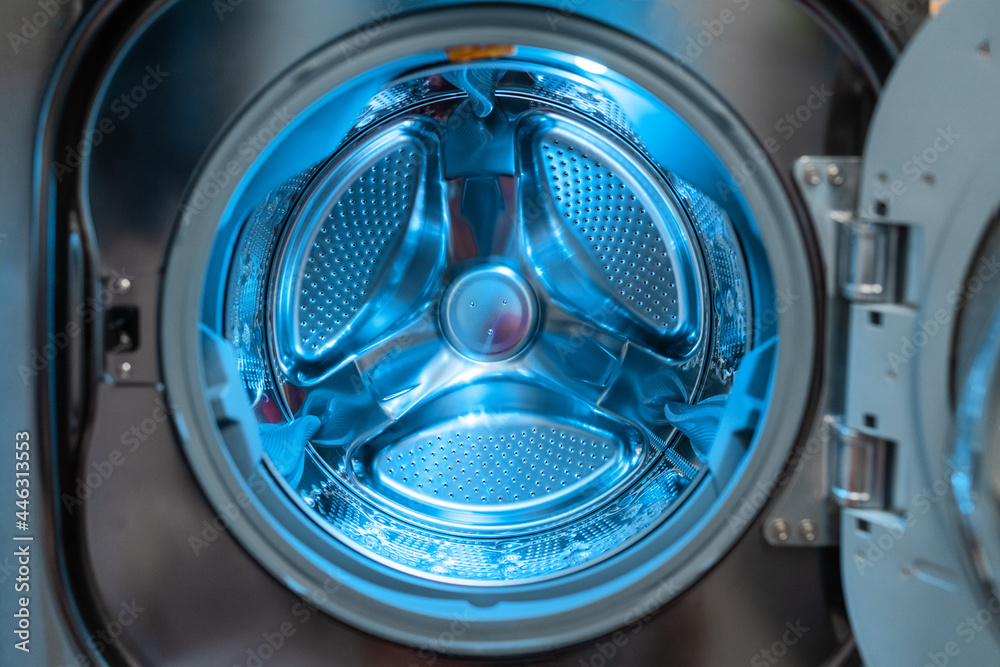 Washing machine laundry home appliance closeup of inside drum. Washing machine laundry home appliance closeup of inside drum.