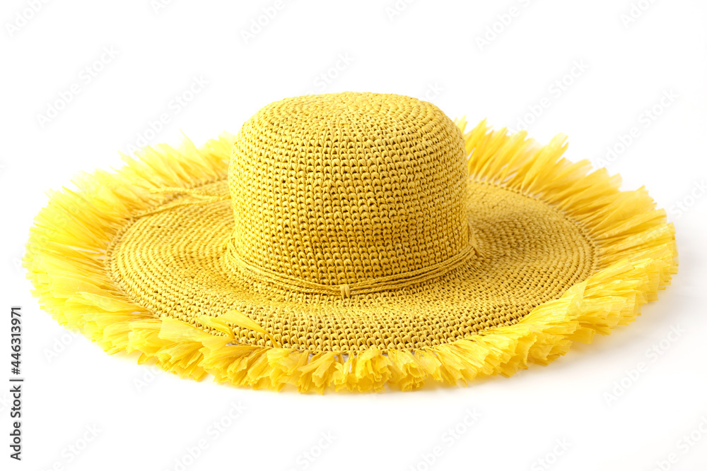 Beautiful straw hat, beautiful with a ribbon and bow on the beach hat, white background.Concept of fashion clothing accessories and beach holidays.Texture of summer straw hat from interwoven raffia. Beautiful straw hat, beautiful with a ribbon and bow on the beach hat, white background.Concept of fashion clothing accessories and beach holidays.Texture of summer straw hat from interwoven raffia.