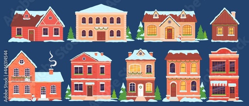 Christmas houses. Buildings with snow caps decorated for winter holidays with lights, xmas tree and wreath. Cartoon town cottages vector set © Tartila