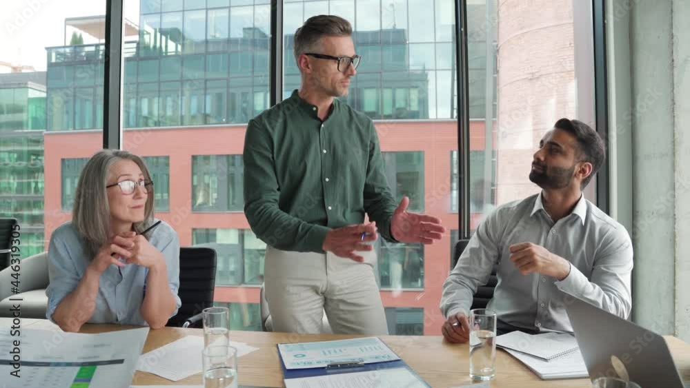 Company ceo presenting project plan at board team meeting. Executive business people group discussing financial strategy and corporate development results working sitting at boardroom table in office.