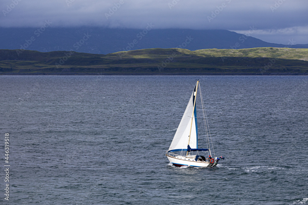 A yacht sailing off the coast of Oban, Argyll and Bute, Scotland, UK