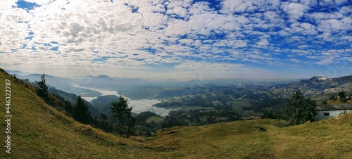 a view of horizon with montains, river, a city and an amazing sky with clouds in Pirapora do Bom Jesus, Brasil photo