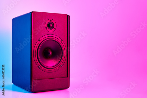 Stereo speaker on purple colored background. Sound audio loud speaker with copy space photo