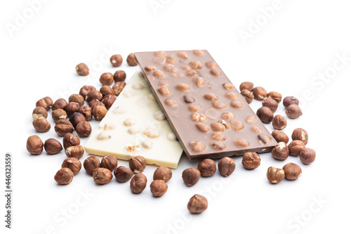 White and dark chocolate bars with hazelnuts.