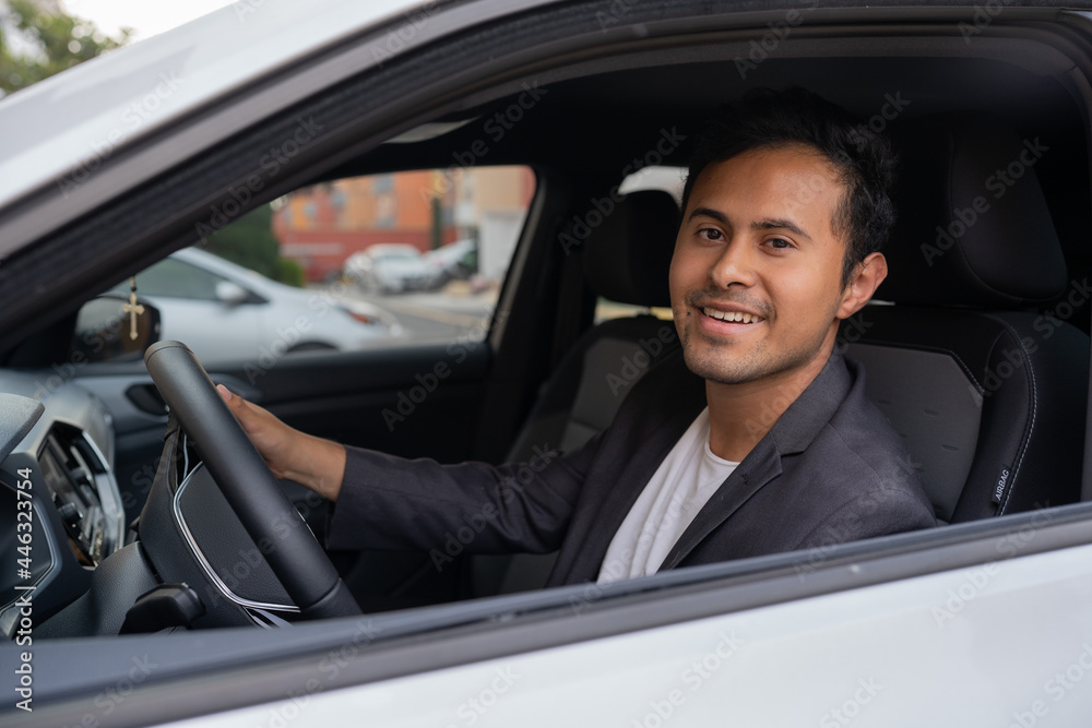 man driving a car