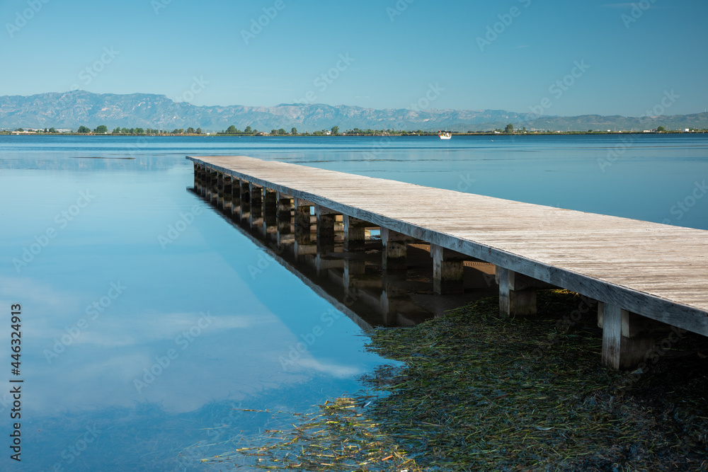 Seascape with wooden breakwater. Morning of blue sky and sea. Peace, tranquility, solitude, calm, relaxation, yoga, zen, spirituality