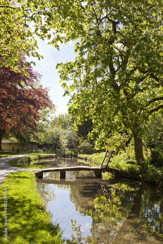 The River Eye flowing through the Cotswold village of Lower Slaughter  Gloucestershire UK