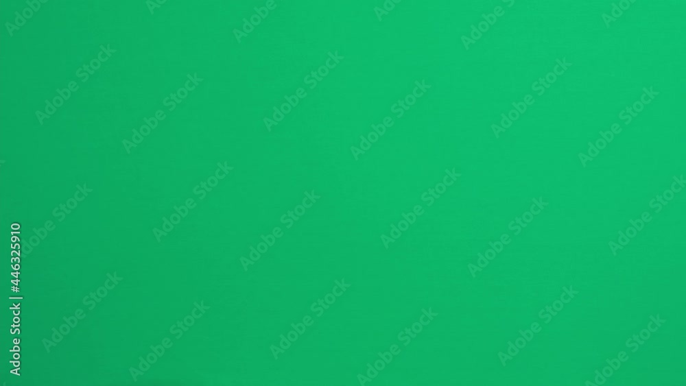 Hand gestures. Teenage boy hand touching, clicking, tapping, sliding, dragging and swiping on green screen chroma key background. Using a smartphone, digital tablet, computer touchscreen