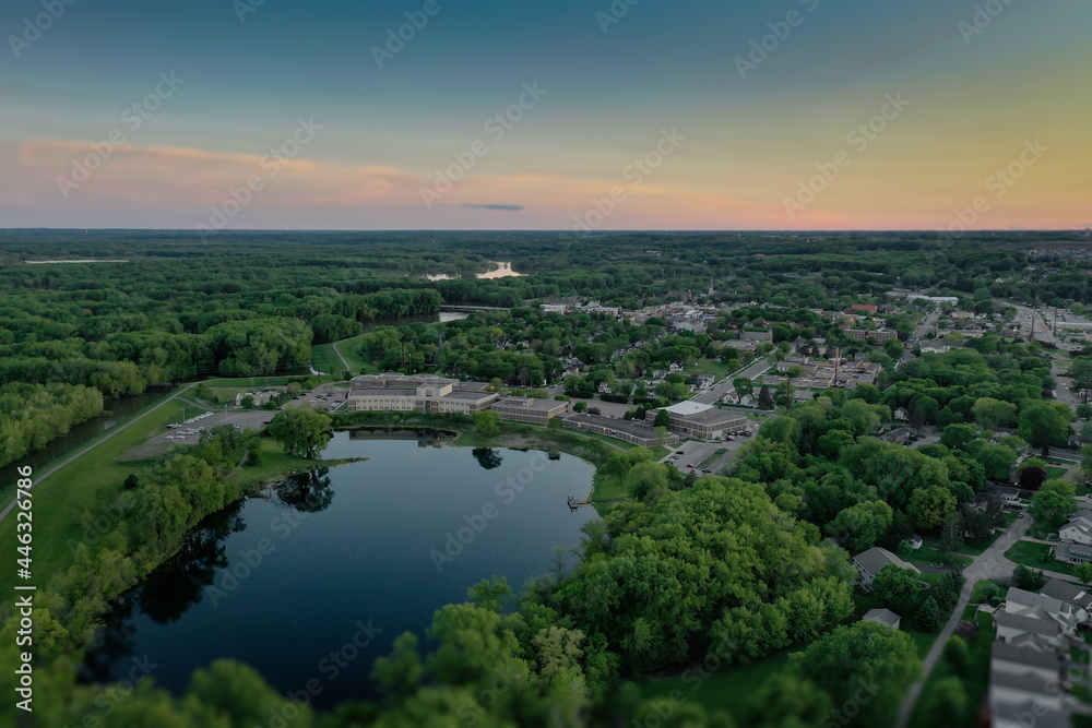 Sunset Sky Over Small Lake in Town Spring Aerial
