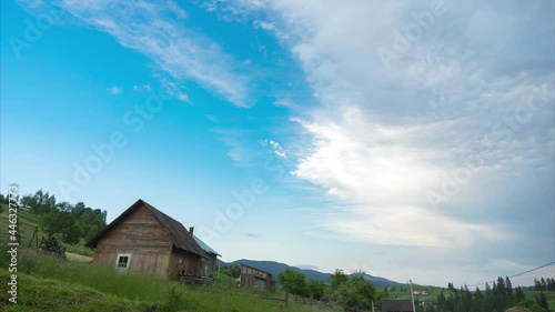 Thundercloud and clear sky over the village, time lapse