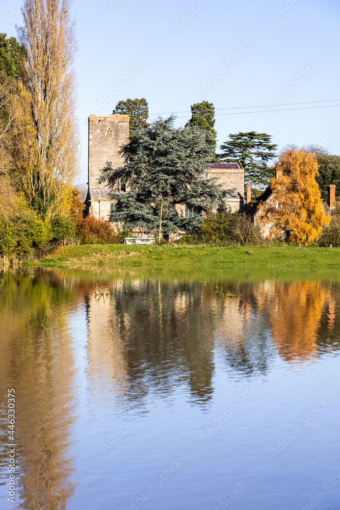 St Marys church viewed across floodwater from the River Severn filling the fields in the Severn Vale village of Deerhurst, Gloucestershire UK on 18/11/2019 St Marys church viewed across floodwater from the River Severn filling the fields in the Severn Vale village of Deerhurst, Gloucestershire UK on 18/11/2019